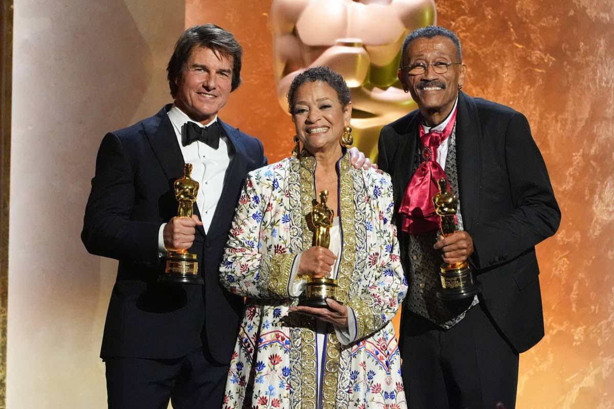 From left: Tom Cruise, Debbie Allen, and Wynn Thomas, winners of Academy honorary awards, pose onstage during the 16th Governors Awards on Sunday.