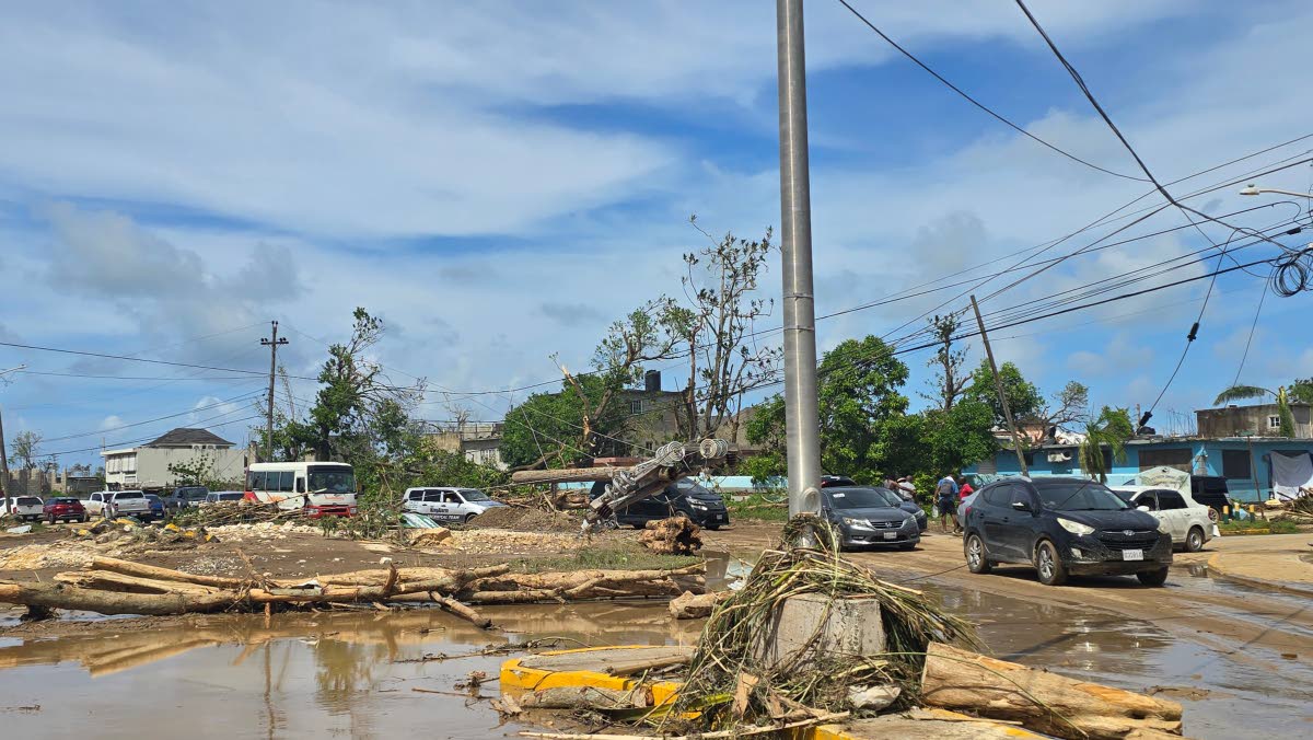 The community of Westgreen inundated with muddy water and debris days after Hurricane Melissa. 