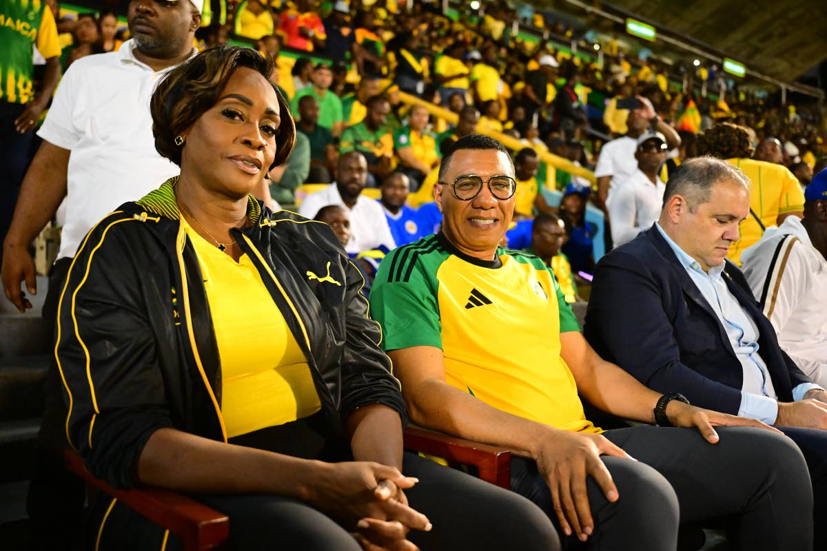 Prime Minister Dr Andrew Holness (second left) and his wife, Speaker of the House of Representatives Juliet Holness, support the Reggae Boyz.