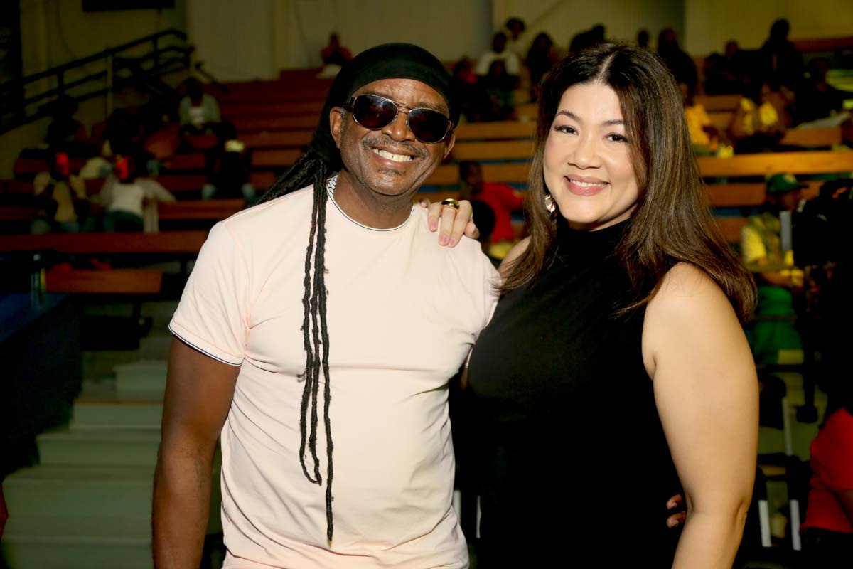Songbird Tessanne Chin shares a moment with reggae veteran Papa Michigan.