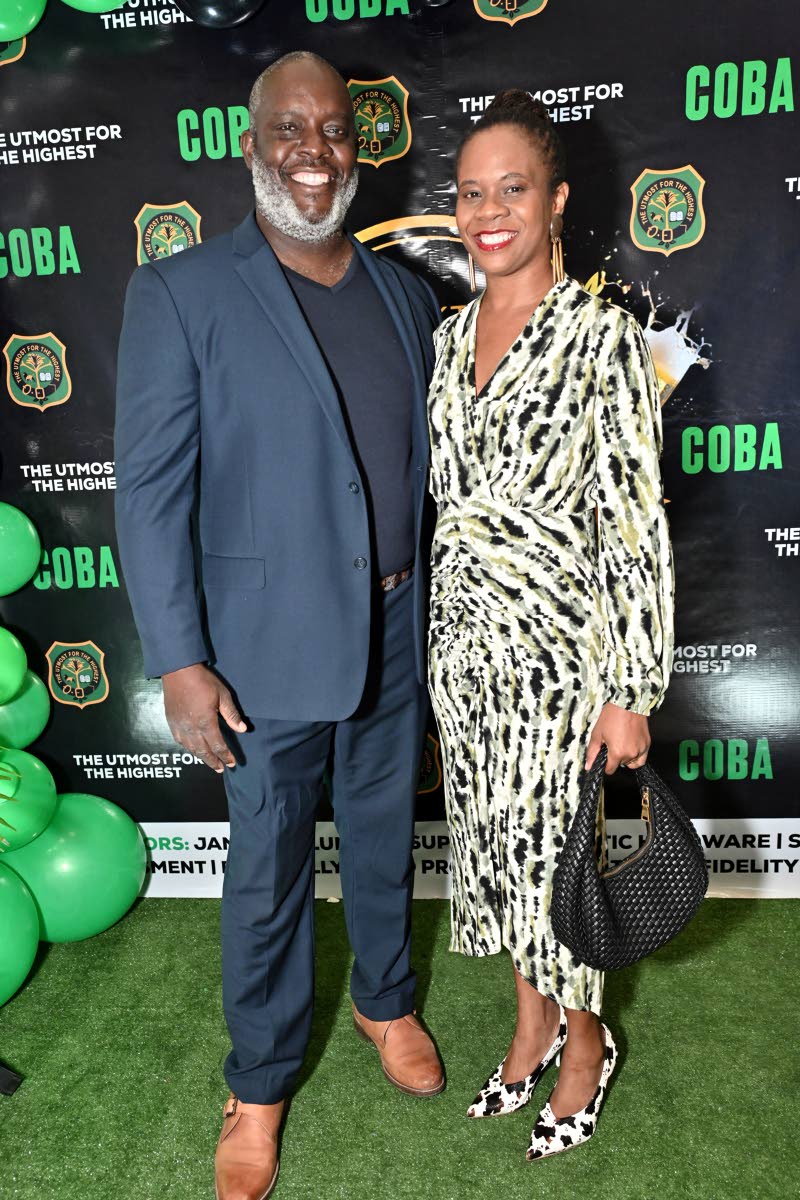 Julian Robinson, head coach of Calabar High School, and his wife, Tamara Robinson, make a stylish entrance at the Calabar Old Boys’ Association Cocktail and Awards Ceremony.