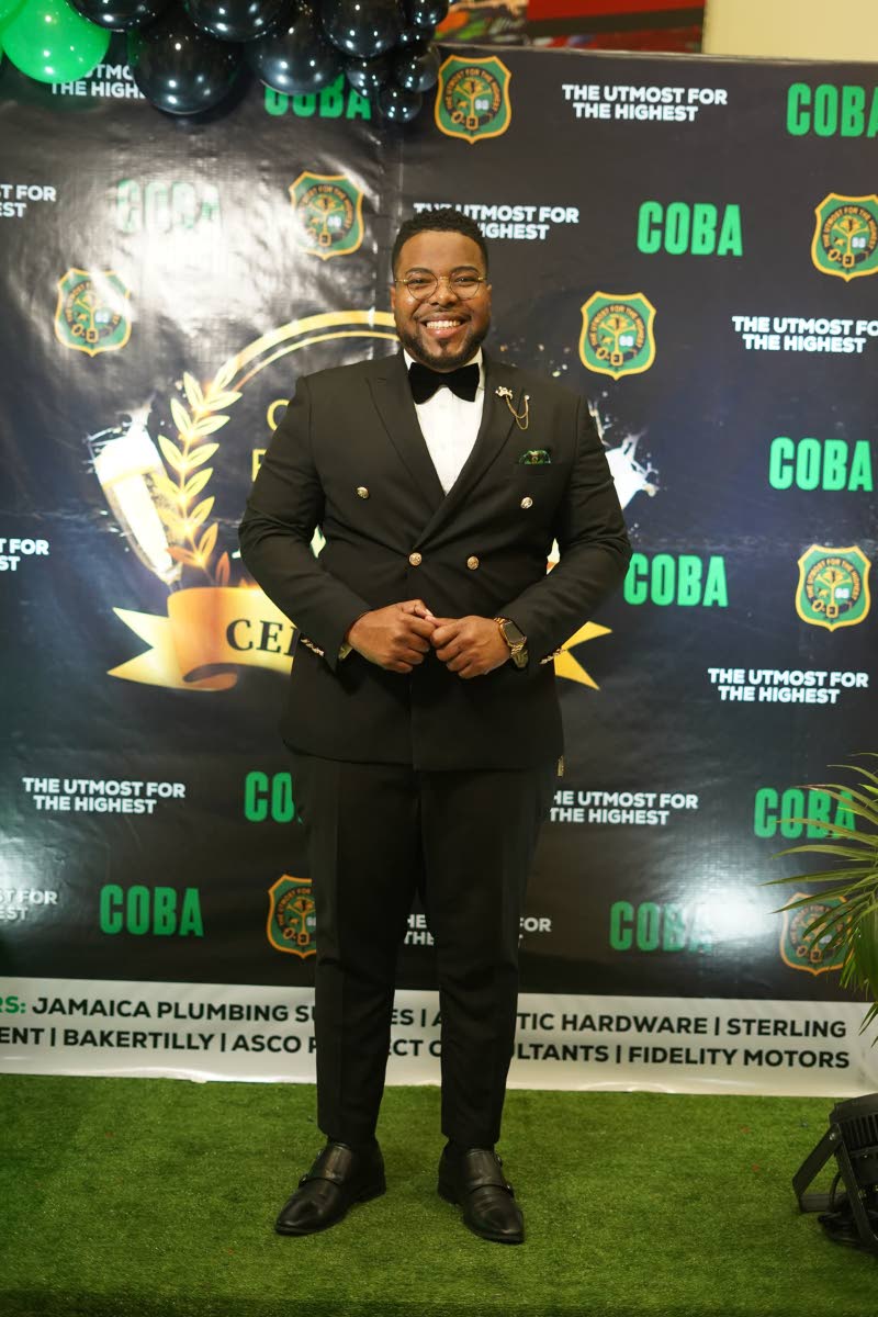 Communication strategist Rajae Danvers dons a black double-breasted suit with gold accents at the Calabar Old Boys’ Association Cocktail Party and Awards Ceremony.