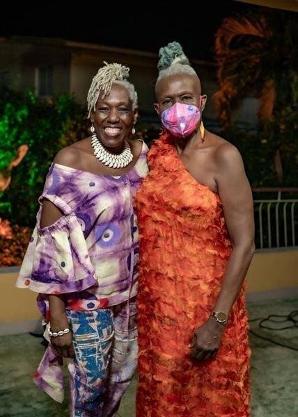 Toasting the woman of the hour, Carolyn Cooper (right), is her sister Donnette, who delivered a heartwarming speech.