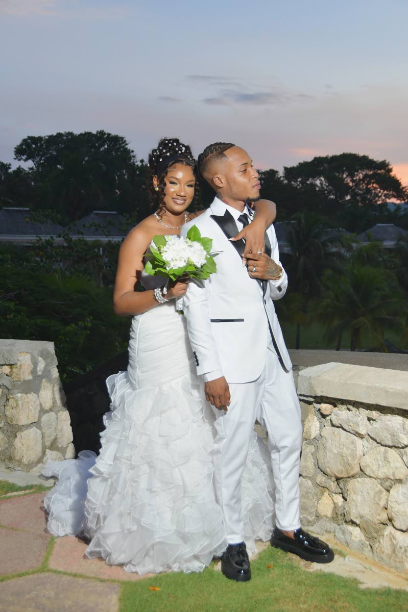 Holding each other close, the newly-weds look ahead to a new chapter of their lives.