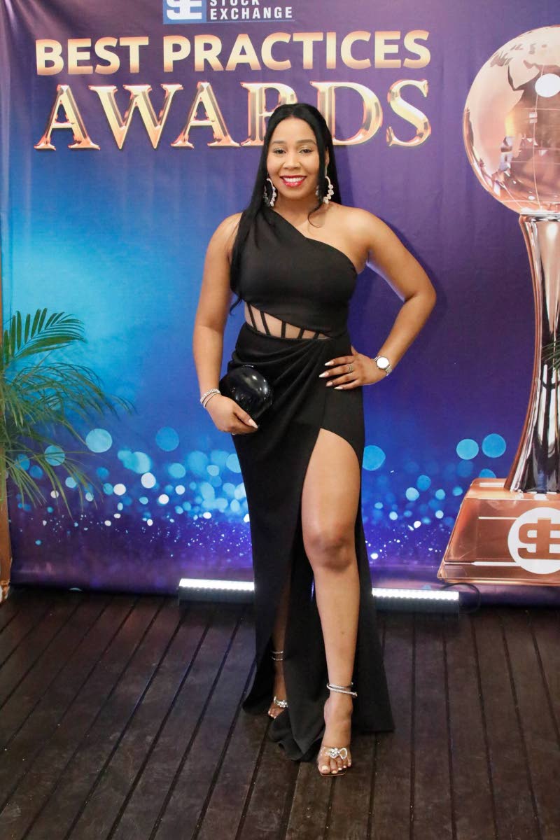 Tashoni Ellis, senior client experience and insights specialist at VM Wealth Management, cuts a striking pose in a daring black dress.