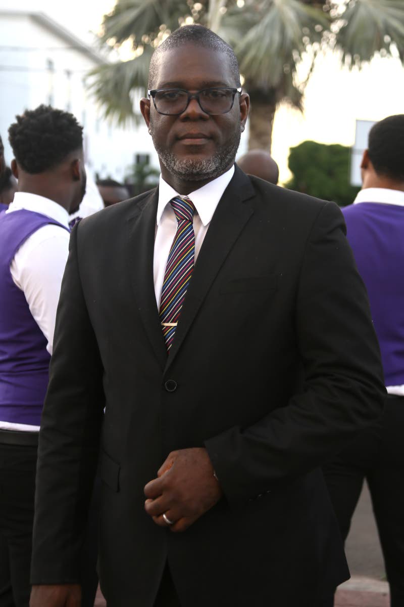 Kingston College Chapel Choir director Audley Davidson pauses for a photo ahead of the evening’s performance.