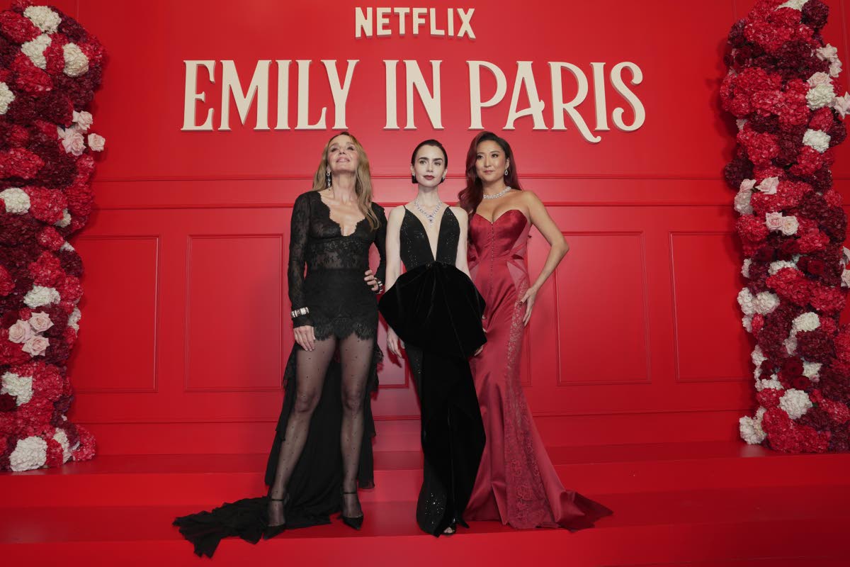 Actresses (from left) Philippine Leroy-Beaulieu, Lily Collins, and Ashley Park pose at the world premiere of the Netflix series ‘Emily in Paris’ season 5, in Paris, France.
