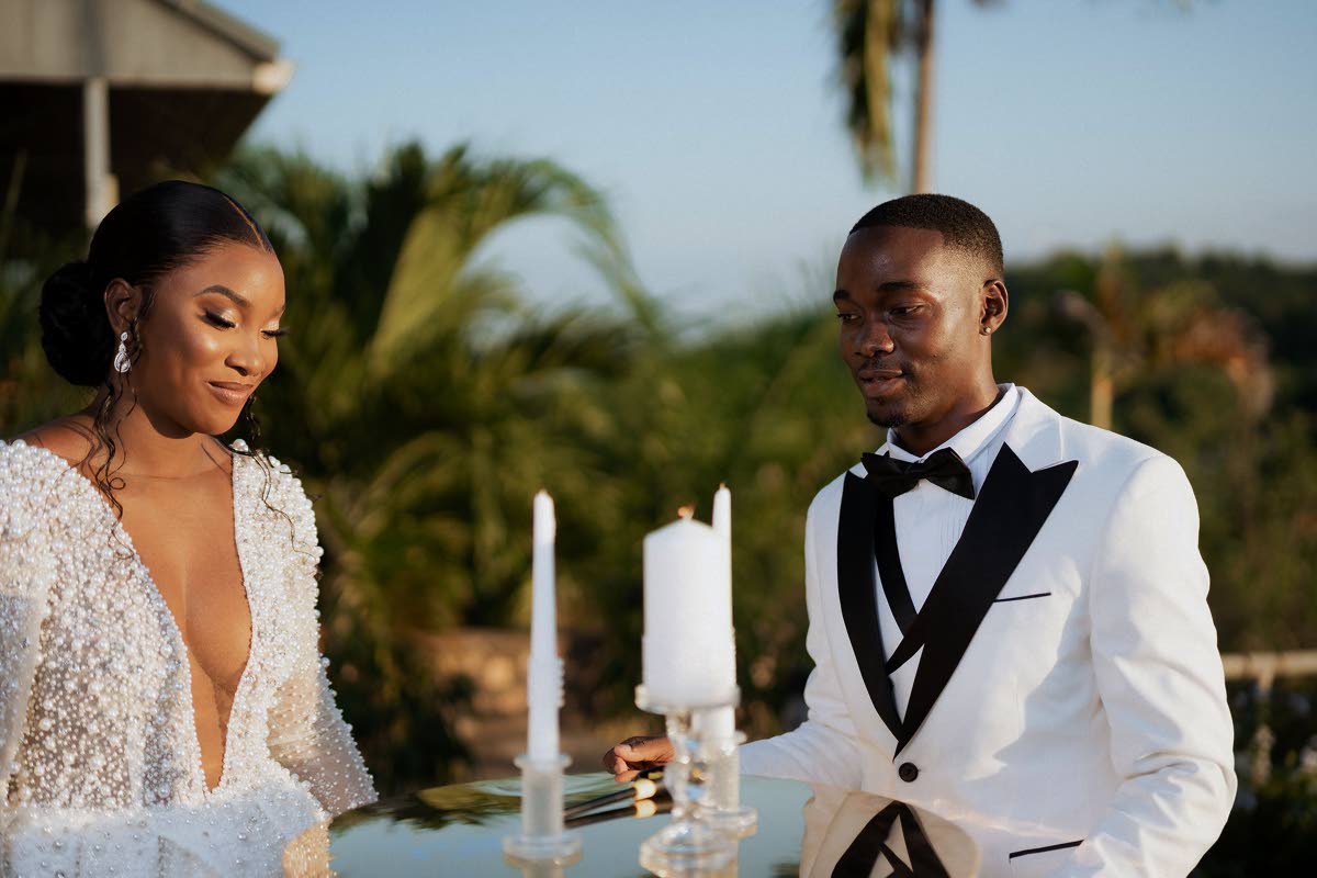 The newly-weds participated in a traditional candlelight ceremony, each taking a separate candle to light a unity candle, symbolising their journey into a new union.