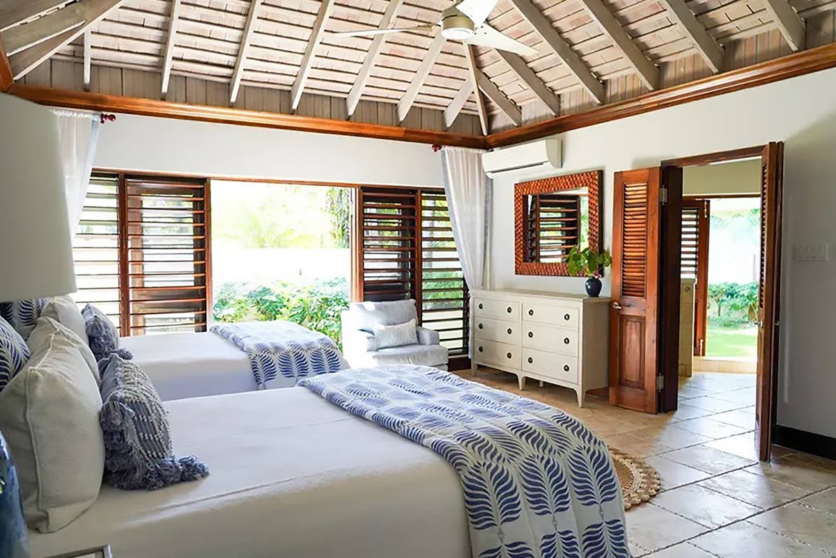 A stylish bedroom embracing the outdoors. 