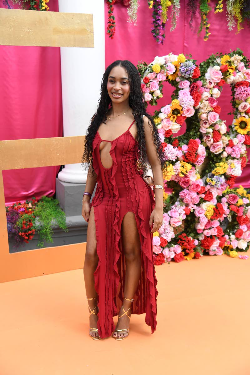 One couldn’t help but stop and stare at Caitlin Hunter, who made a striking statement in a daring crimson dress.