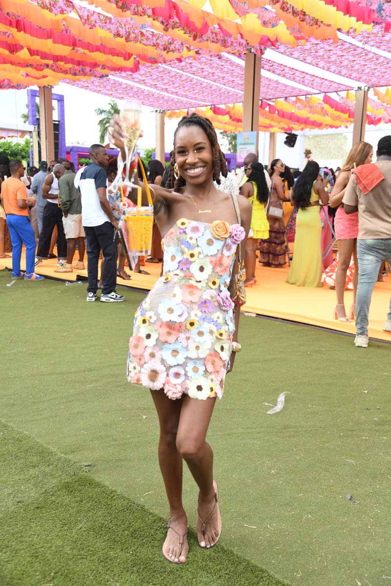 Sunnation’s marketing officer, Janne-Marie Ollivierre, brings floral flair to the brunch event in a floral appliqué spaghetti-strap mini dress.