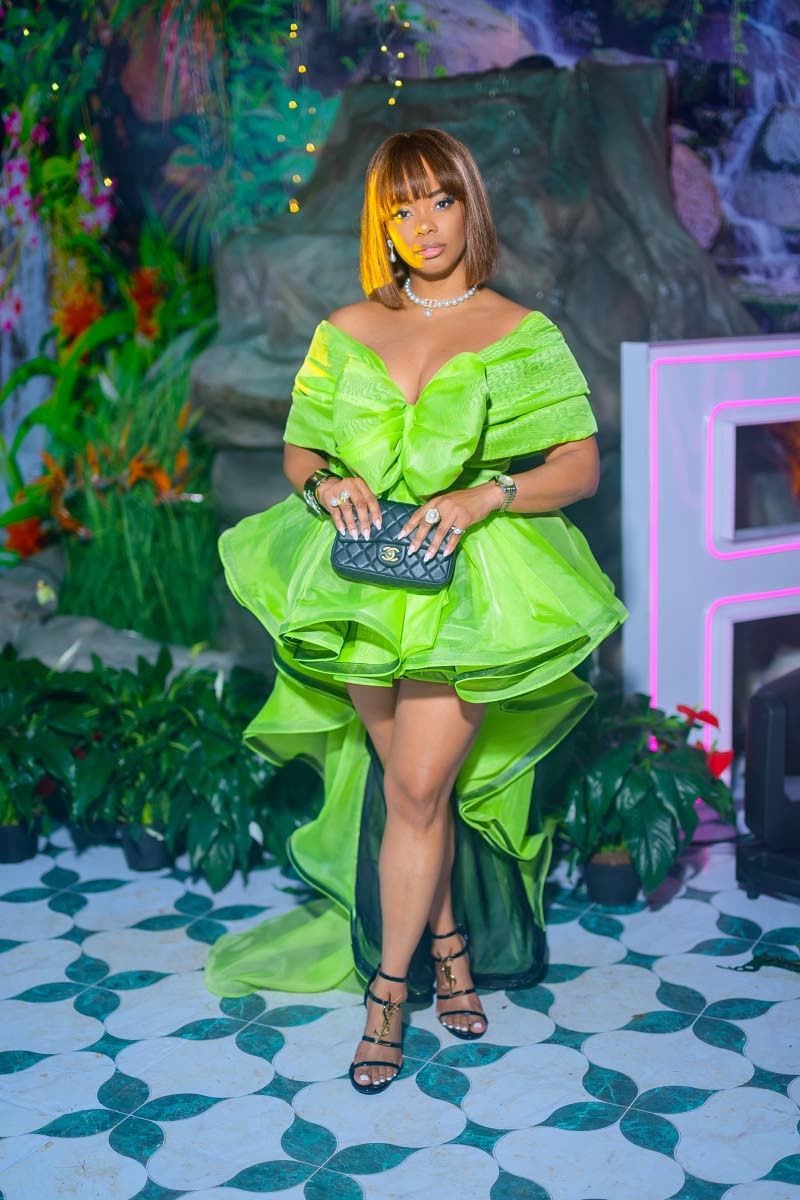 Flight Attendant Diedra ‘JaSkyPrincess’ Allen sweeps into Frenchmen Climax in a custom tiered lime hi-low dress and statement Yves Saint Laurent heels.