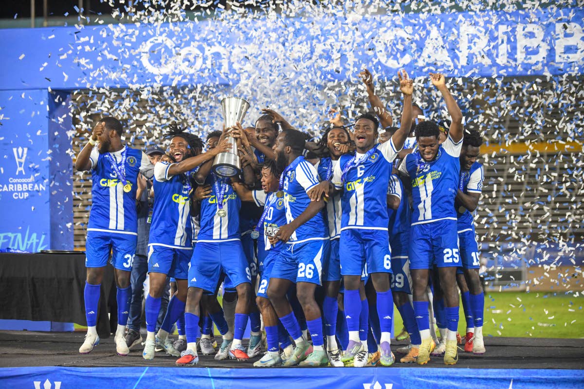 Members of the Mount Pleasant Academy team celebrate their win in the Concacaf Caribbean Cup final at the National Stadium on December 2, 2025.