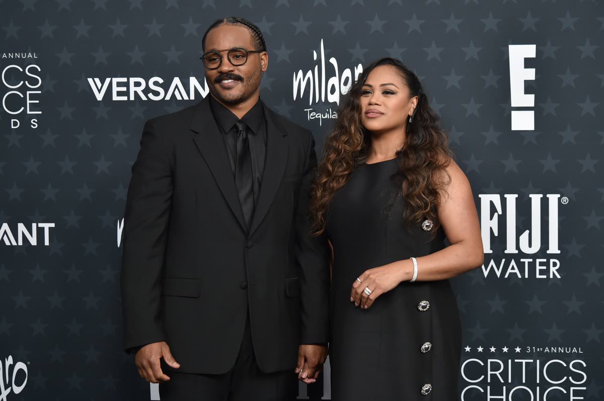 Ryan Coogler and wife Zinzi Evans hit the black carpet in Louis Vuitton. 