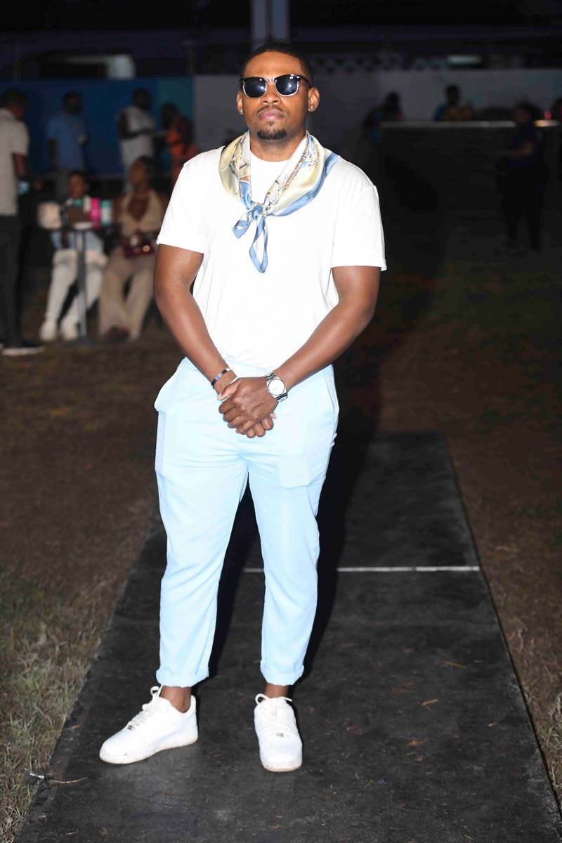 Demari Brown, a member of the US Army, dons baby blue trousers and a classic white T-shirt and lowtops. 
