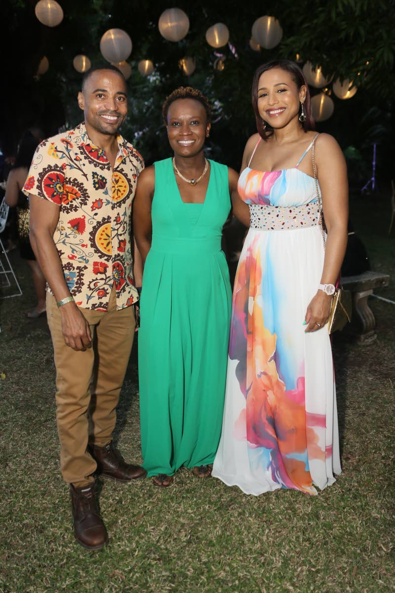 From left: Jamin Atkins, NCB’s manager of payment platforms and orchestration; Deposit Manager Sabrina Barton and Taryn Buddo-Minott, vice-president of group underwriting, pause the festivities for a perfect-picture moment.