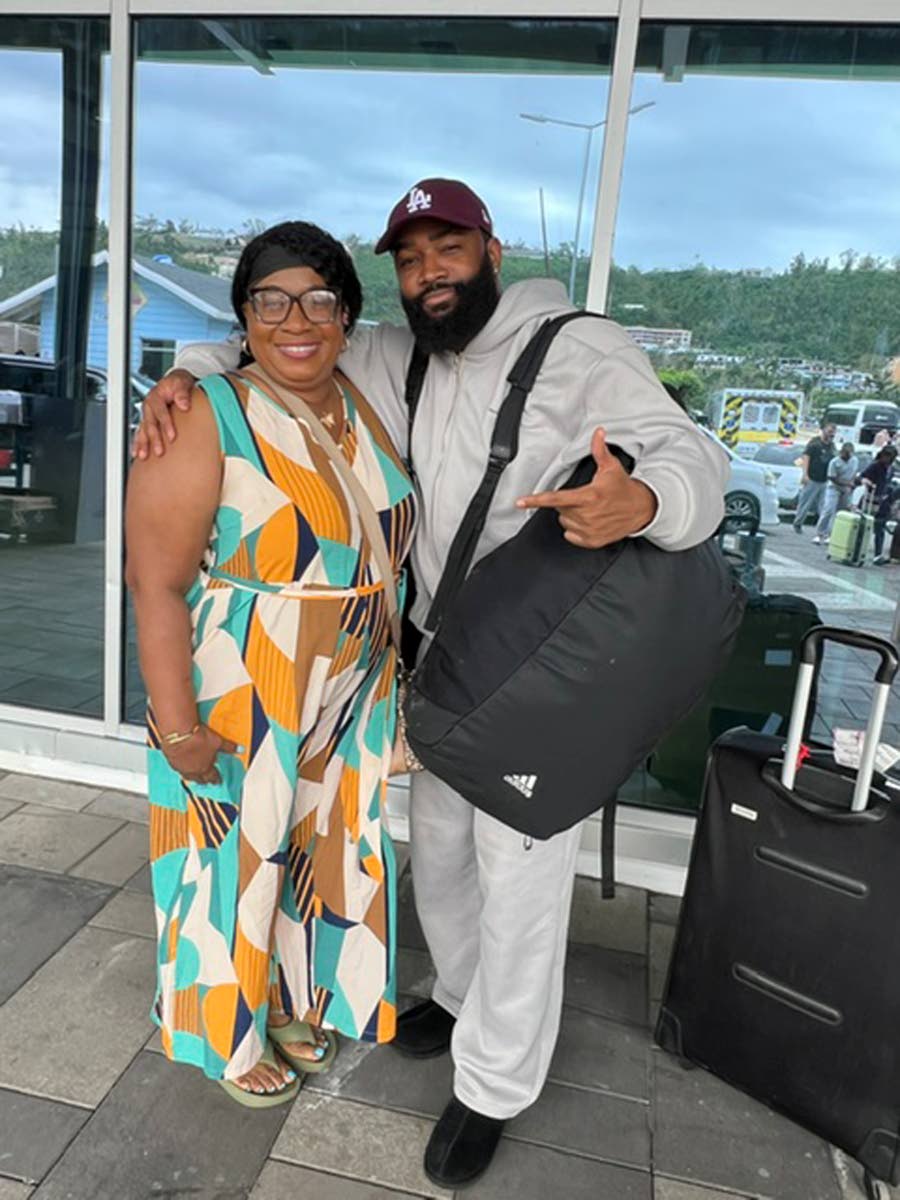 The very reason for the trip back home, Smith takes a photo with his beloved mother, Racquel Duncan, before jumping on a plane back to Japan.