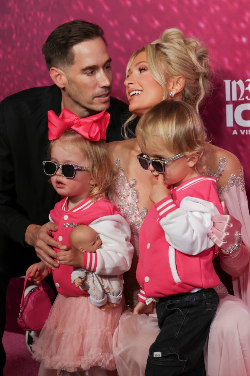 Joined by her husband, Carter Reum, and their two children, Phoenix (right) and London (second left), Hilton celebrated the evening with them in coordinating outfits featuring, of course, pops of pink.