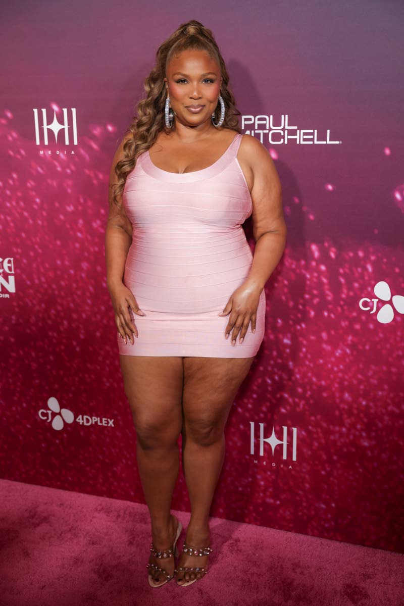 Lizzo is all dolled up in a bodycon mini.