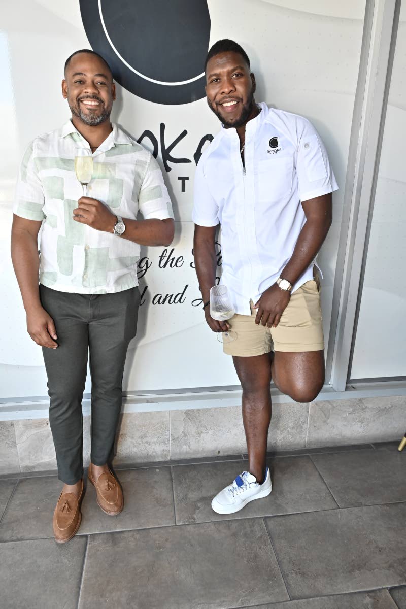 Co-founders of Broken Plate, Kwasi Henry (left) and Chef Damion Stewart, keep it cool and simple as they pause their confab for a quick snap.