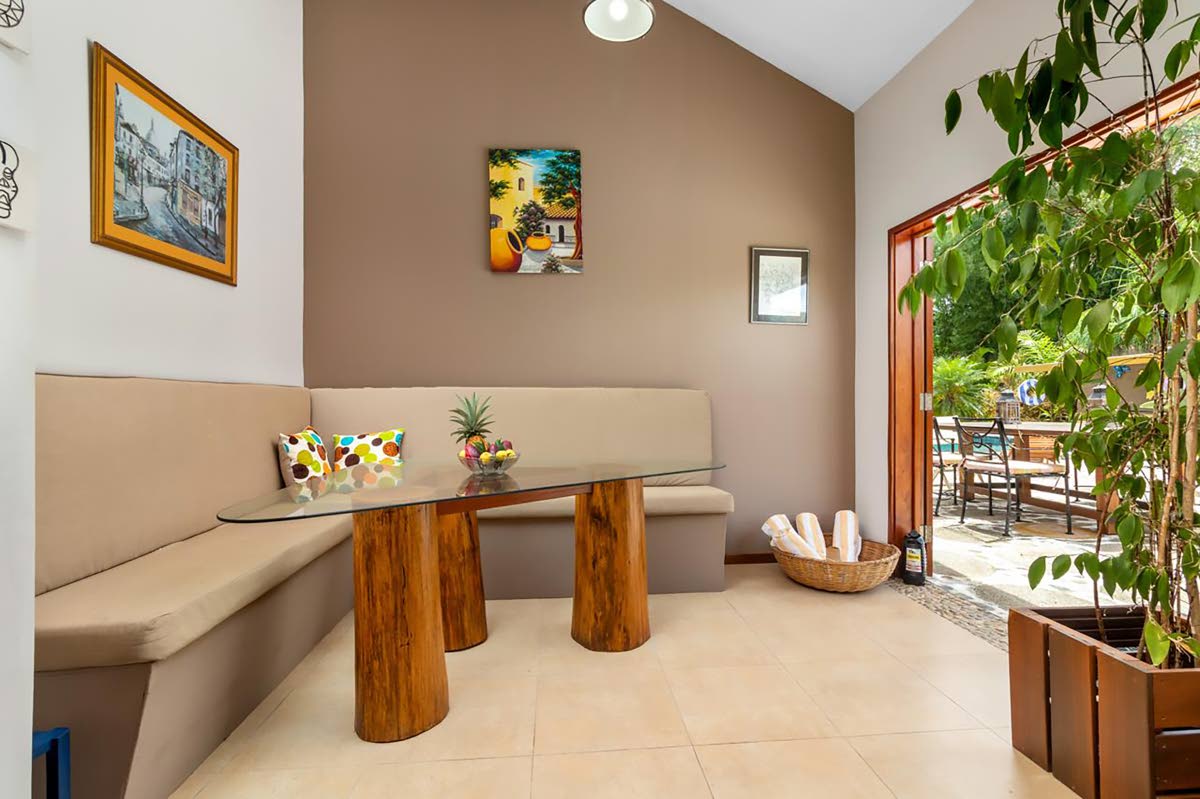 A dining area just off the kitchen features a most unusual table and seating design.