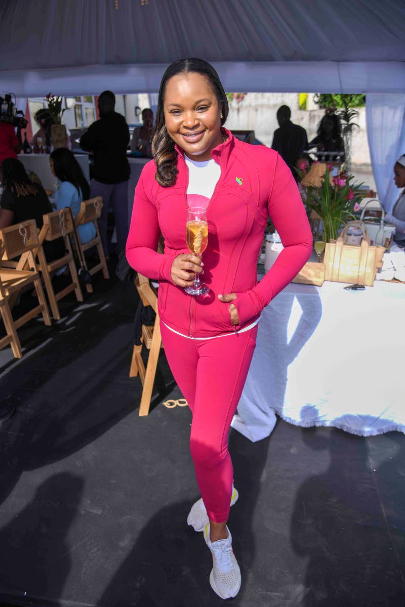 Daidre Sloley McKay, vice president of marketing in Jamaica and Latin America, Sagicor Group, dons a deep-pink zip-up jacket and leggings for the session.