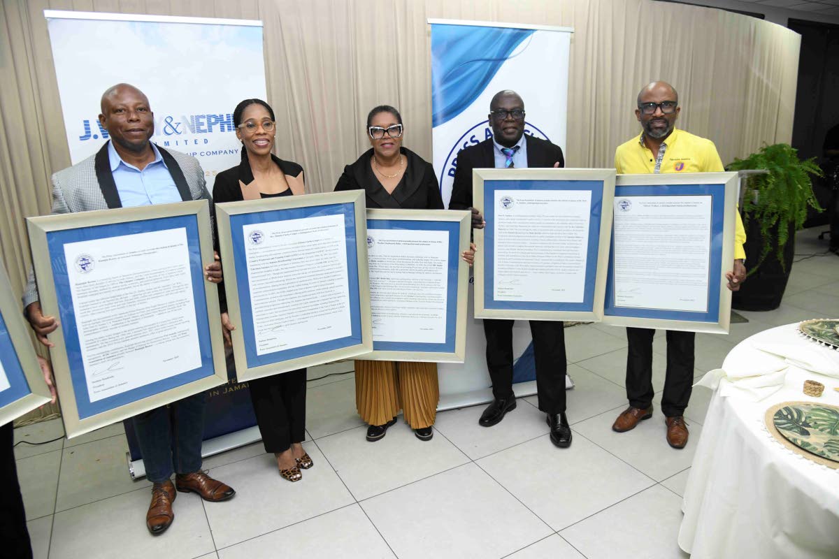 From left: Rudolph Brown; Simone Clarke; Marlene Stephenson Dalley; Pete Sankey and Milton Walker pose with their citations after being recognised as veteran journalists at the Press Association of Jamaica’s veterans luncheon held on March 4 at J. Wray a