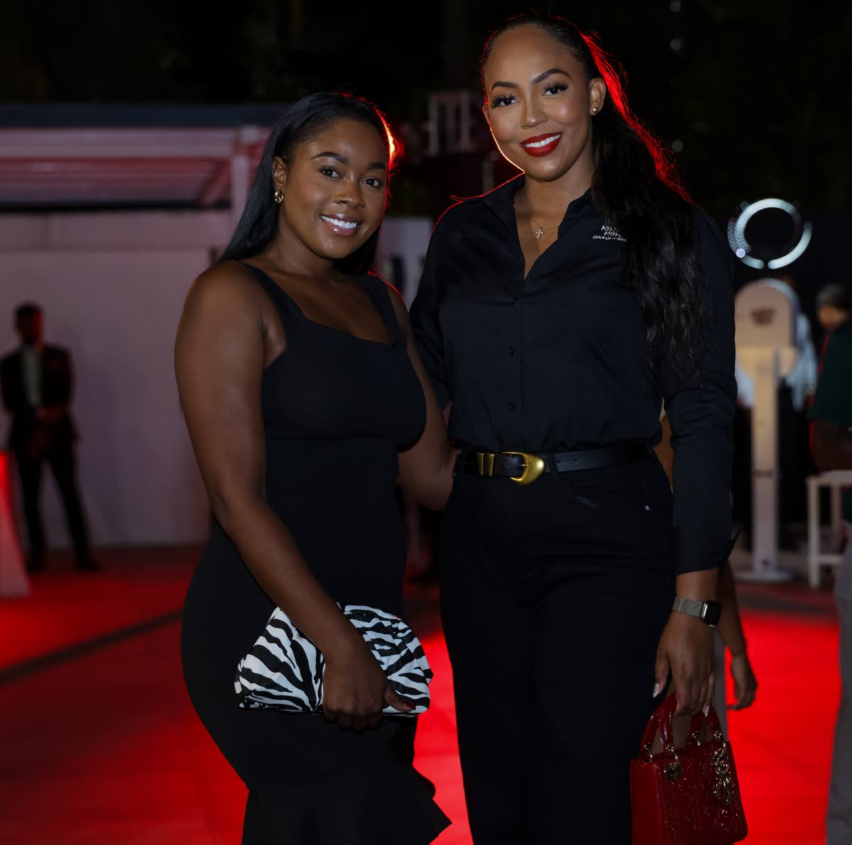 Mishka Hall (left), senior financial services specialist at VMBS, joins Jeneque Pinnock, group marketing manager, Stewart’s Automotive Group for a quick photo.
