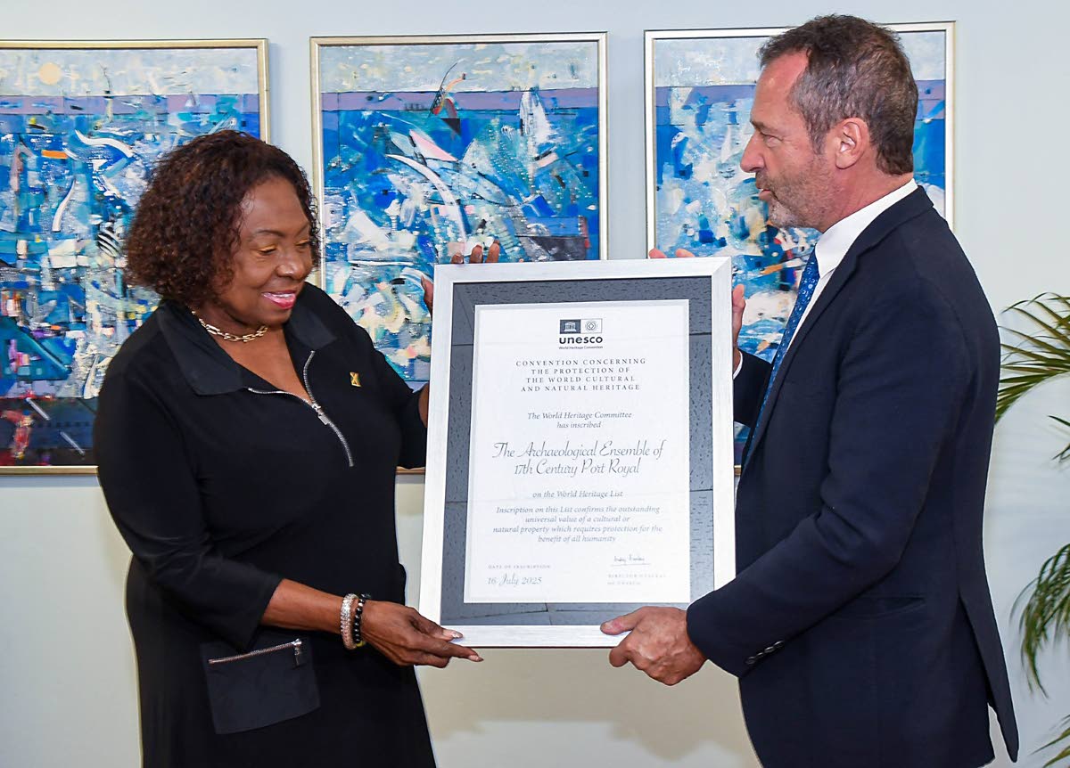 Minister of Culture Olivia Grange accepts from Regional Director and Representative of the UNESCO Cluster Office of the Caribbean, Eric Falt, the Certificate  of Inscription classifying Port Royal as a World Heritage Site. 