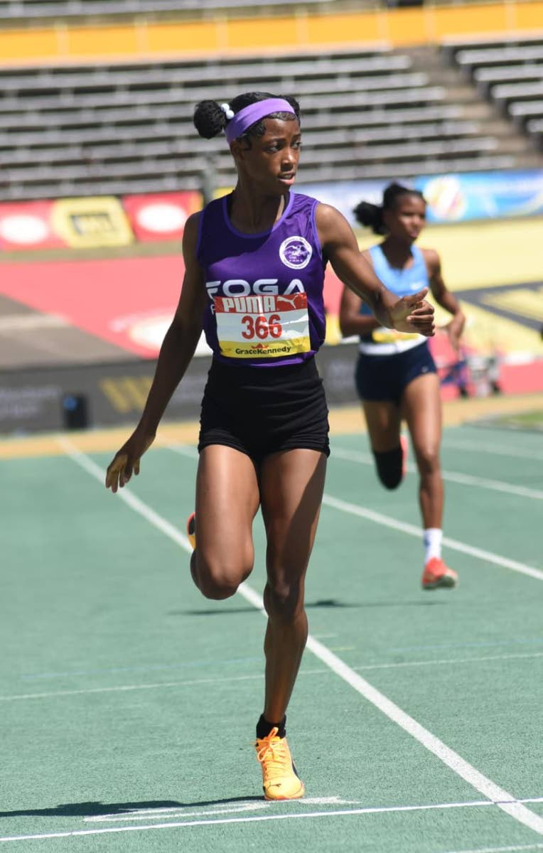 Shameika McLean of Fogo Road High crossing the line first in her in the Girls’ Class Two 400m at Champs 2026.