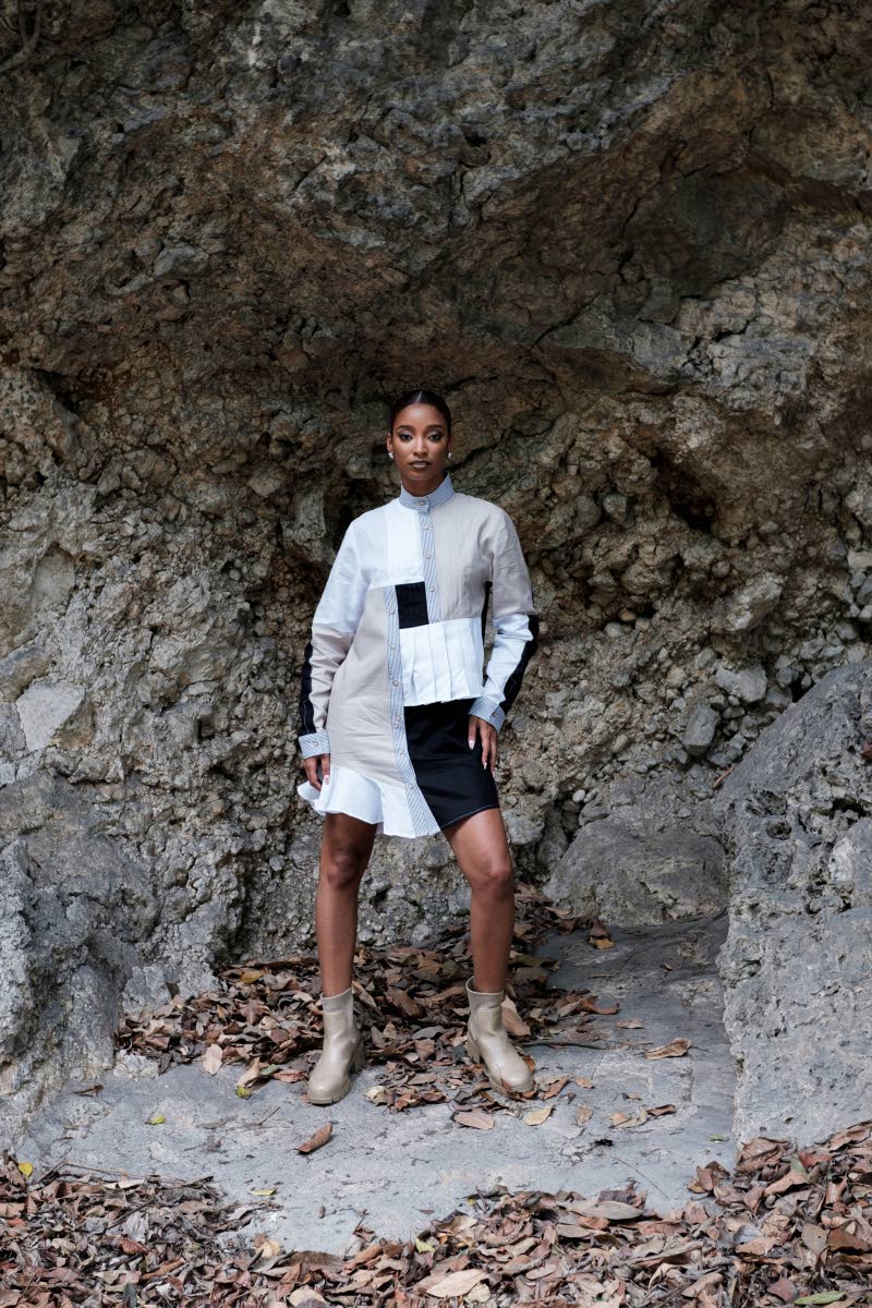Above: Pistol black, pure white and ash grey combine to create this asymmetrical colour-block linen shirt dress. Howell’s design also features raised and inward pintucks, knife pleat tucks, pinstripe and subtle flare panel detailing, with a Mandarin coll