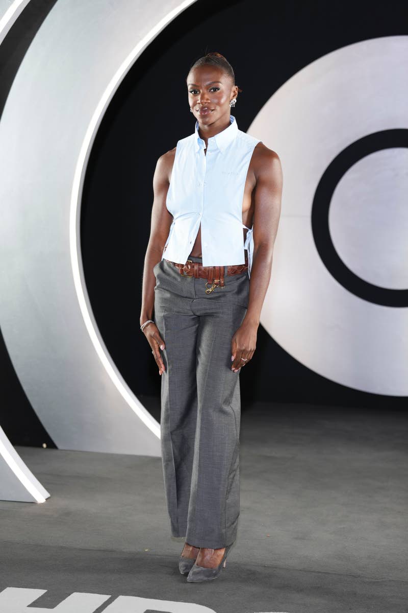 British sprint superstar Dina Asher-Smith wears Miu Miu with Manolo Blahniks and jewellery by Susannah Lovis Jewellers.