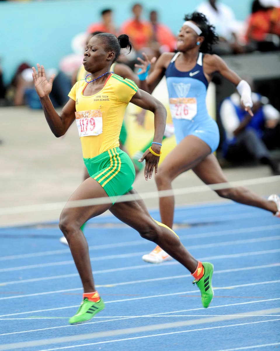 Shericka Jackson of Vere Technical High wins  Class One 200 metres at Champs 2013.  