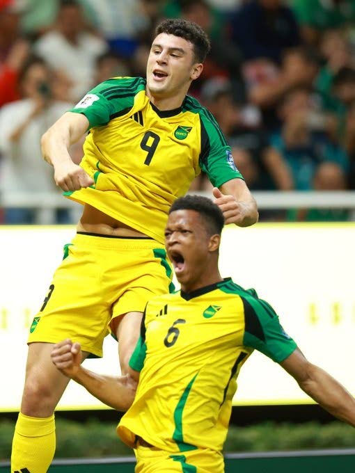 Goalscorer Bailey Cadamarteri (left) and defender Richard King celebrate after Jamaica took the lead against New Caledonia during their FIFA World Cup intercontinental playoff match in Guadalajara, Mexico on Thursday night. Jamaica won 1-0.