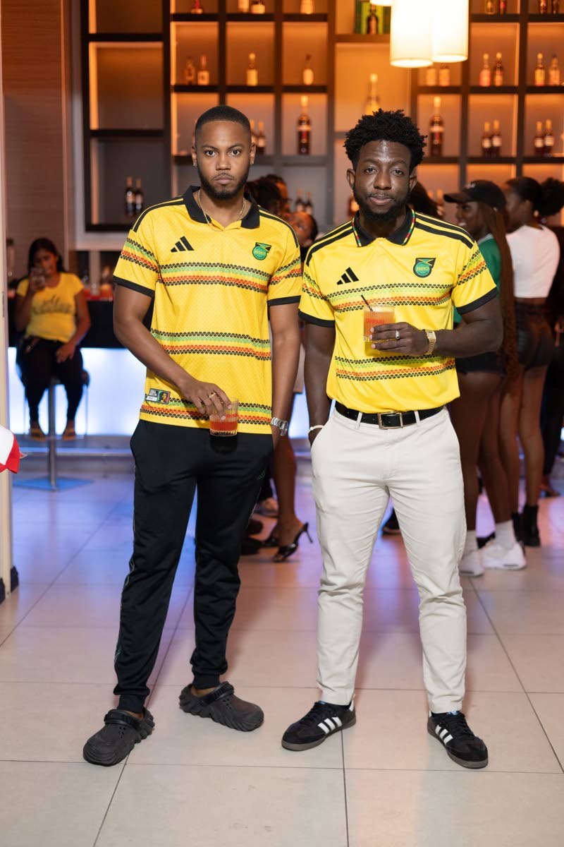 Pausing their confab for a photo opportunity are Nicholas Dundas (left), entrepreneur, and Jevon Williams, digital content marketer. 