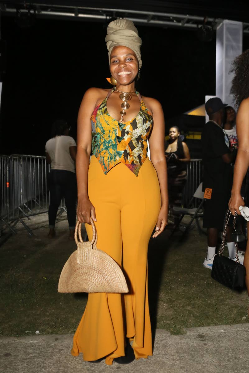 Stacia Davidson, brand partnership manager and sister of T.O.K. group member Xavier ‘Flexx’ Davidson, waited, rattan purse in hand, for the group to hit the stage. 