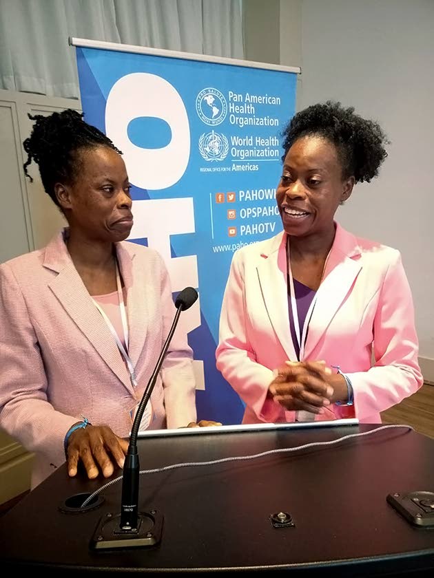 Dr Tamara Henry-Gilpin (left) in conversation with her sister Dr Tamika Henry following an event organised by Pan American Health Organization.