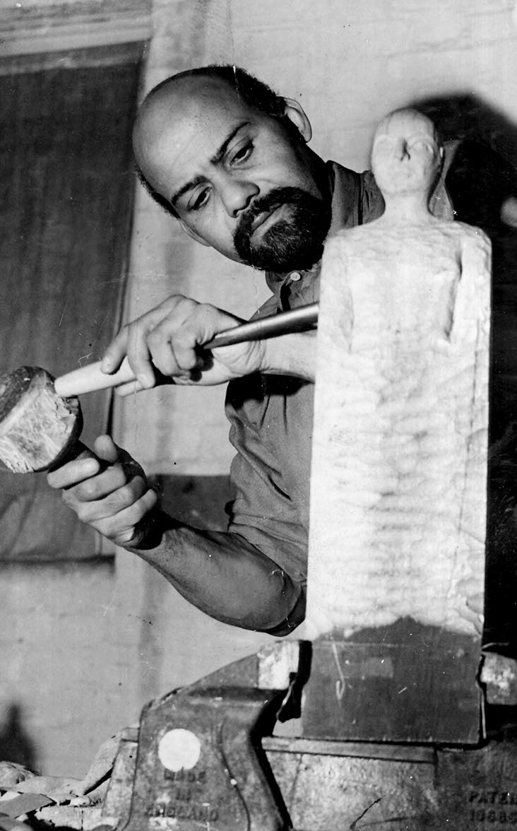 A JAMAICAN ARTIST IN LONDON. Completed by Mr. Ronald Moody in his Paris studio just before the German invasion, a fine carving is to be placed in the Library of the new Colonial Office when it is built on the site of the old Westminster Hospital.