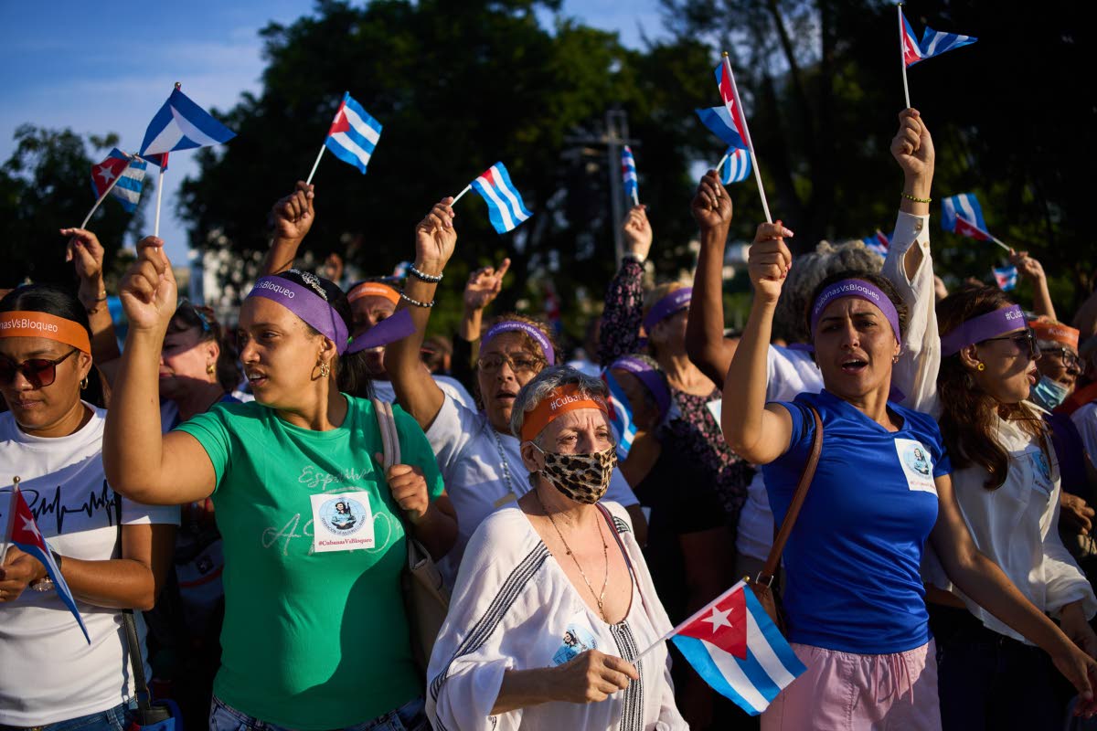 Women attend a rally calling for the end of the US blockade against the island nation in Havana, Cuba, on Tuesday.