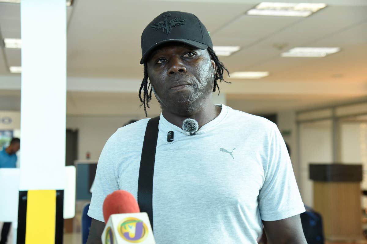 Garth Smythe,  Shanoya Douglas’ coach. 