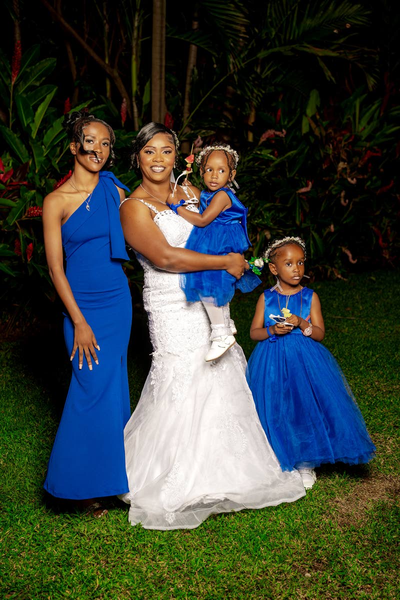 The bride, Nicole, poses with her daughters: (from left) Torri-Lee Cameron, Jevona Dyer and Nickoya Dyer. 