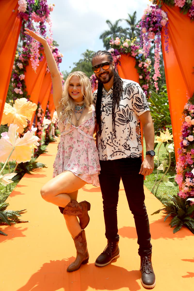 Reggae artiste Skygrass, with his fiancée, Nicole Arbour, are ready to fête, Arbour dolled up in florals and boots.