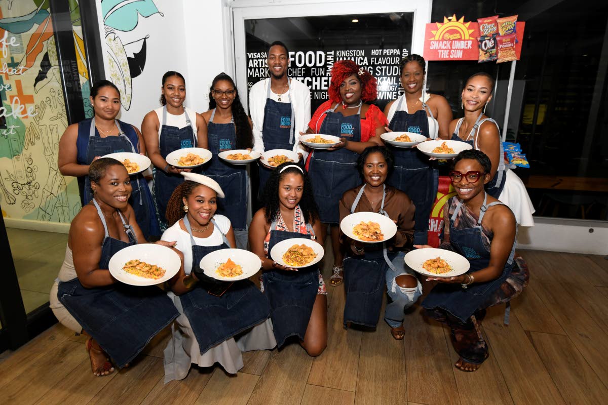 Participants in the Tabanca in the Kitchen: Passport to New Orleans session pose with their completed dishes on Monday. 
