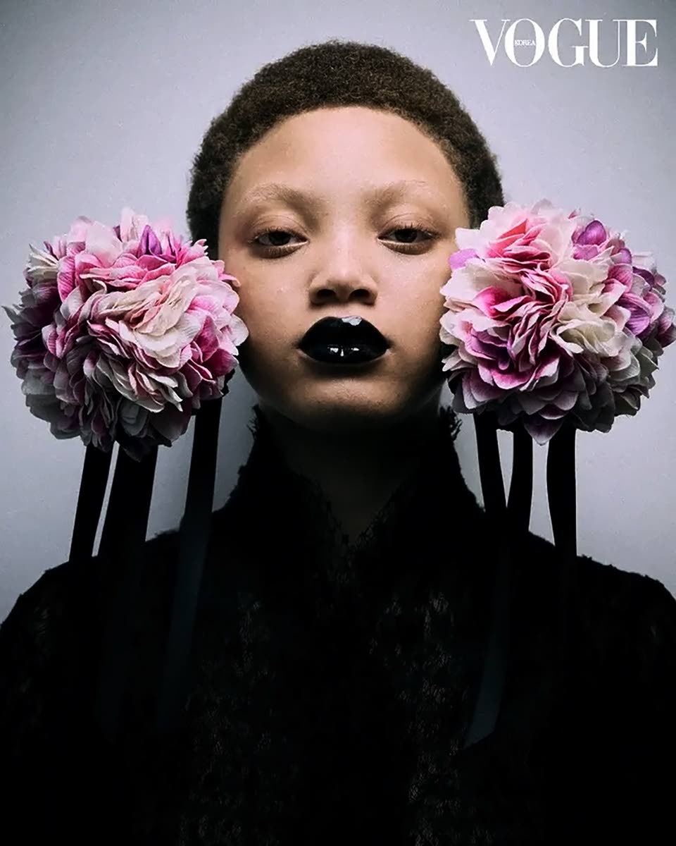 With a focus on the spring/summer couture designer collections unveiled in Paris back in January, the new ‘Vogue Korea’ editorial spotlights SAINT’s Sanique Dill in a black mesh dress and floral earpiece by Dior Haute Couture.