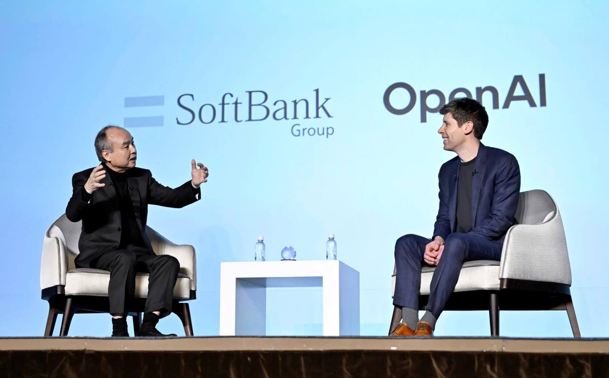 SoftBank Chief Masayoshi Son, left, and OpenAI Chief Sam Altman hold a talk during an event for enterprises in Tokyo, in Tokyo, Monday, February 3, 2025.