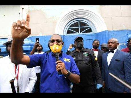 Organiser Joseph Patterson, head of the United Independent Congress, addresses protesters during a march against COVID-19 vaccines in Kingston on September 22, 2021, moments before he was arrested and charged. (Rudolph Brown photo)