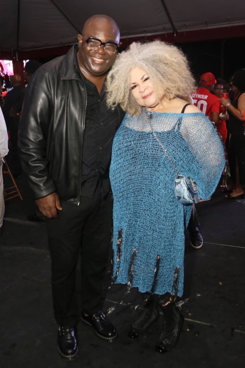 Pausing their confab, Cordell Green poses with Dr Maria Myers-Hamilton for the camera.