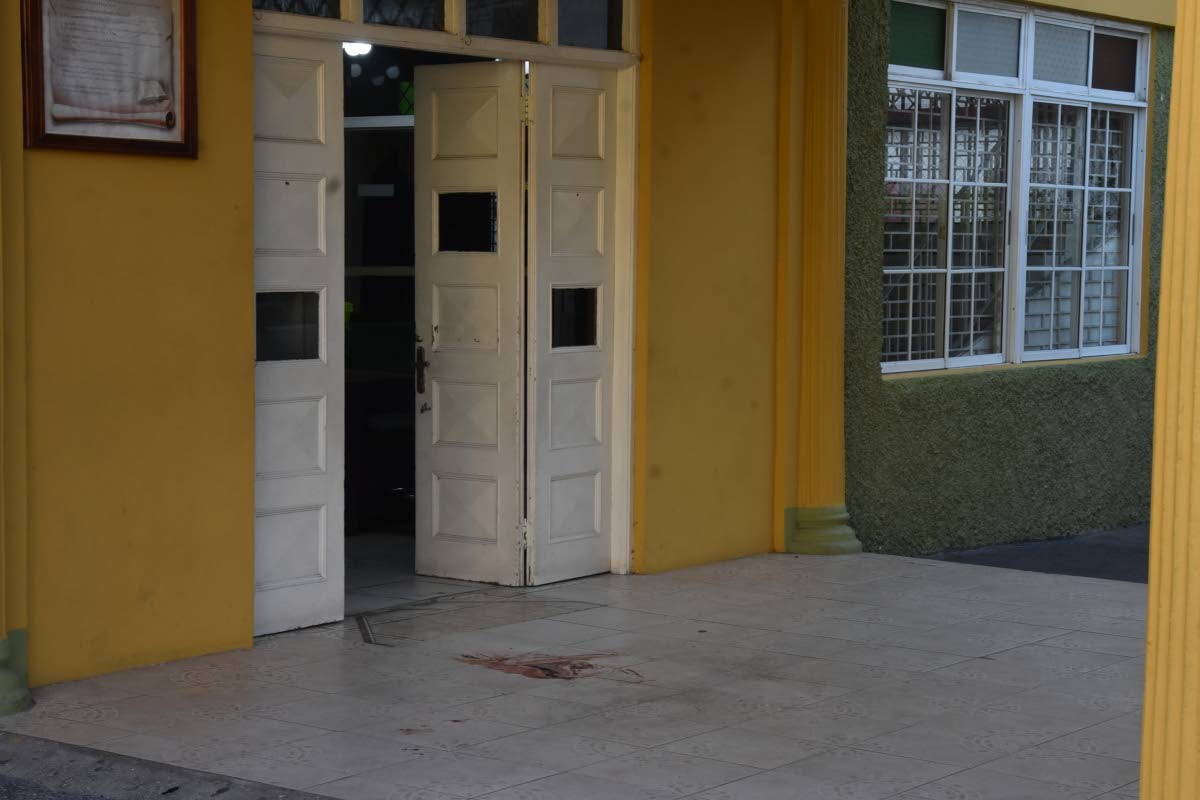 The area where Cora Thompson's body laid after she was shot by an unknown gunman on Wednesday inside the church yard at the New Testament Church of God in Montego Bay, St James. 