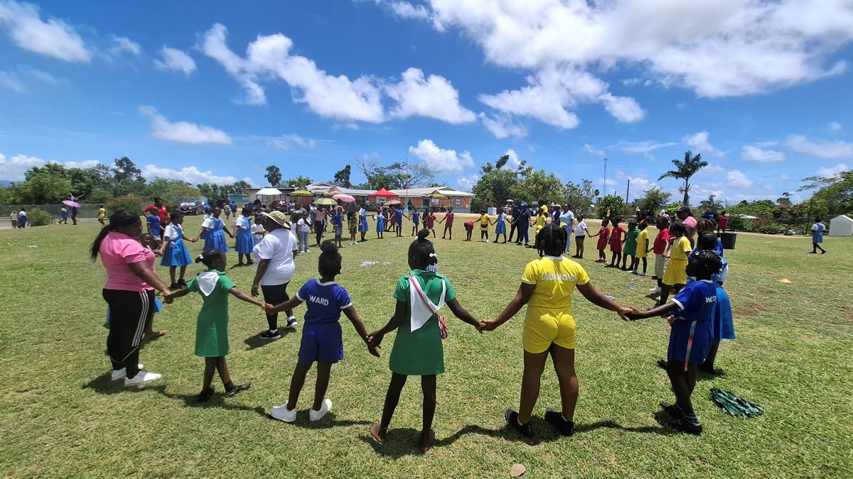 Students form a circle as they prepare for the third activity of the day called ‘Shape Freeze’ during which music is played while students are encouraged to move around freely before forming shapes when the music stops. 