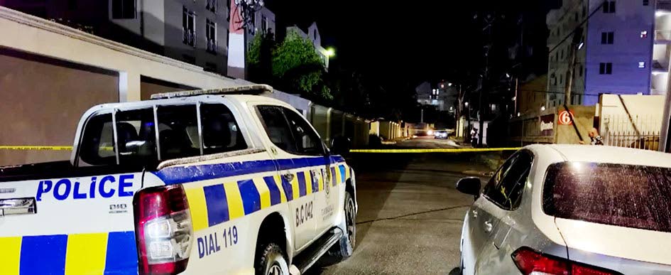 The police on the crime scene in the vicinity of Kensington Court in New Kingston on Friday night.
